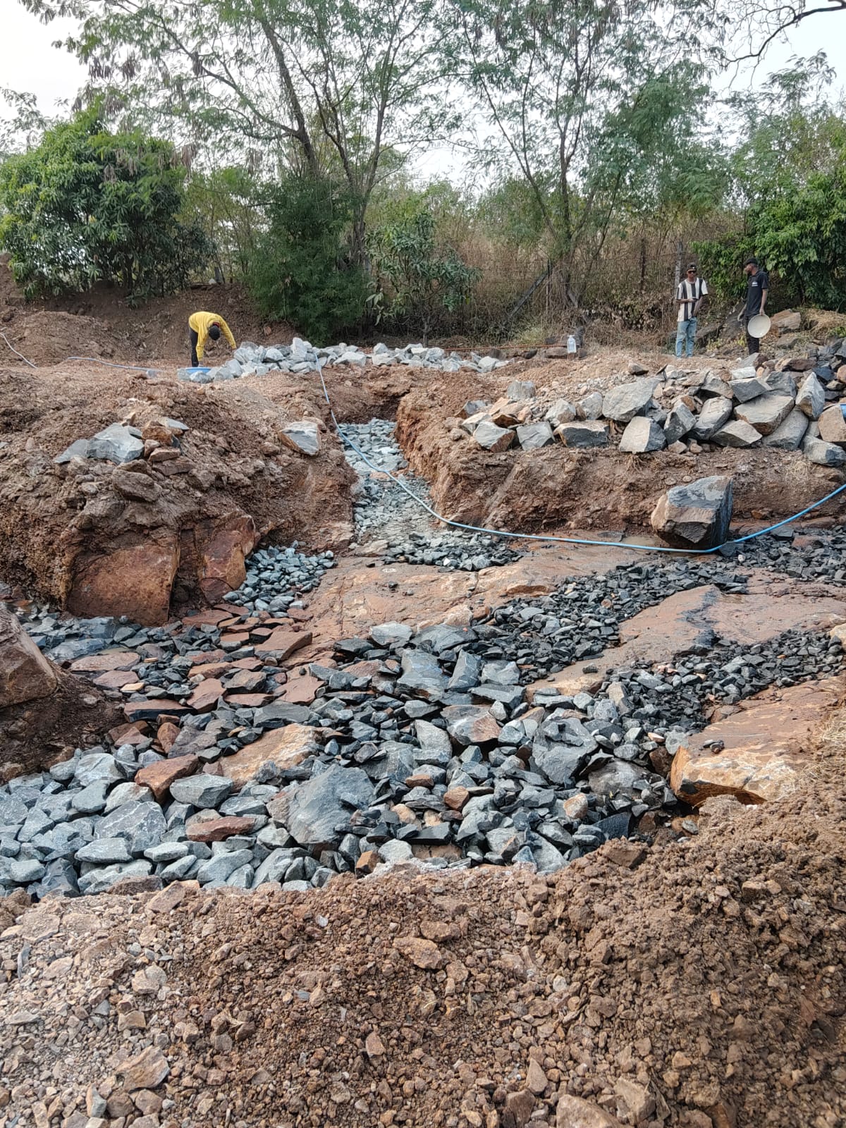 Trench bottoms leveled with small stones before the PCC pour